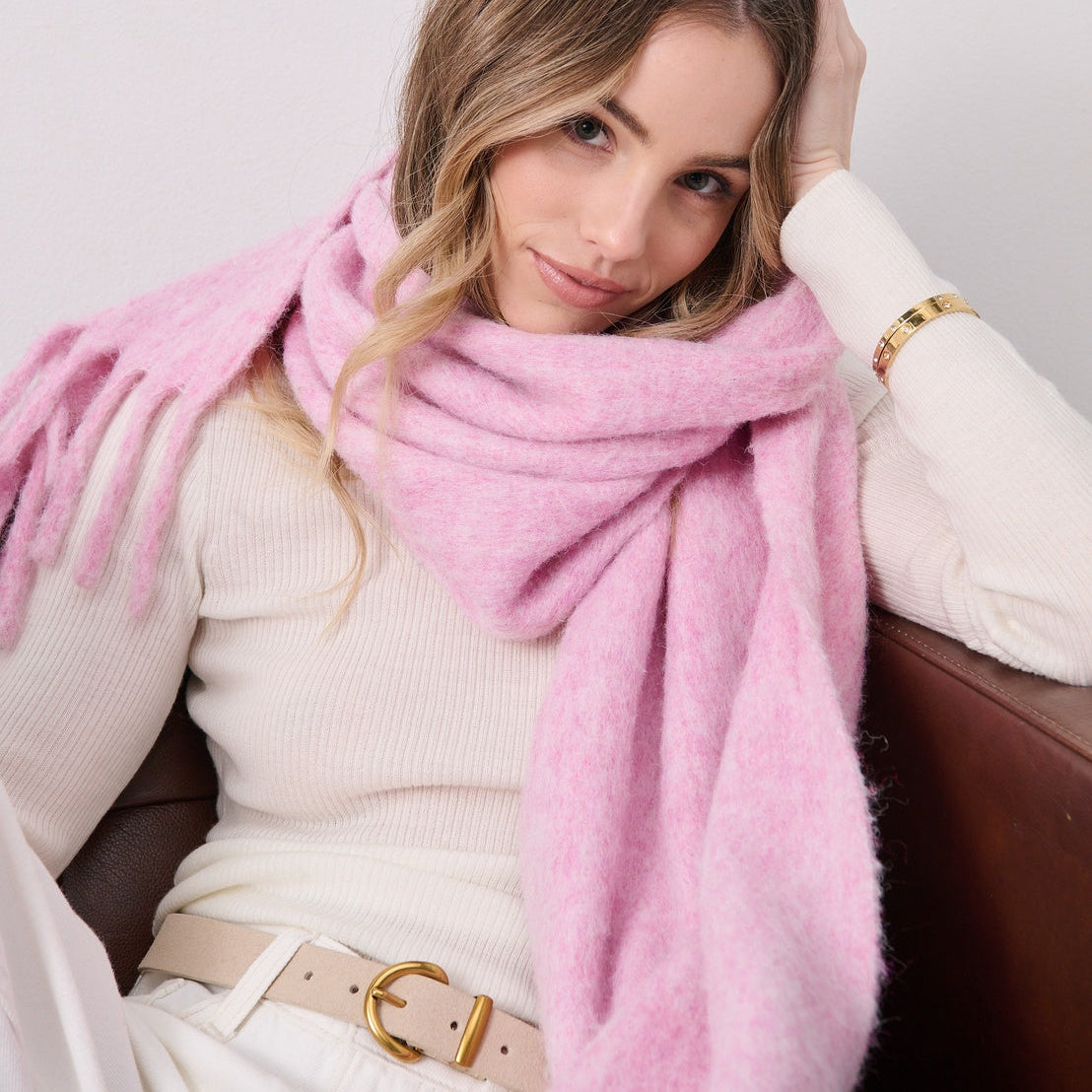 Woman wearing a pink scarf