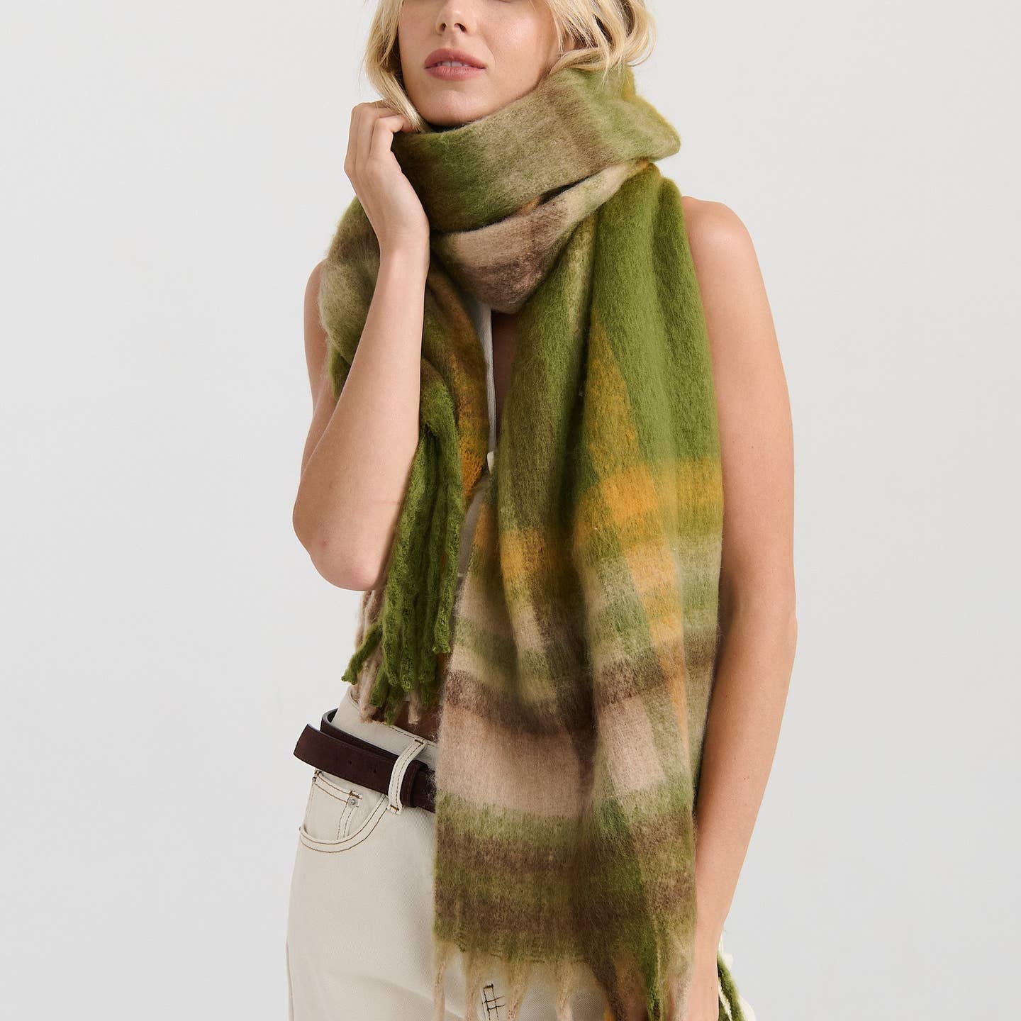 Person wearing a green plaid scarf 