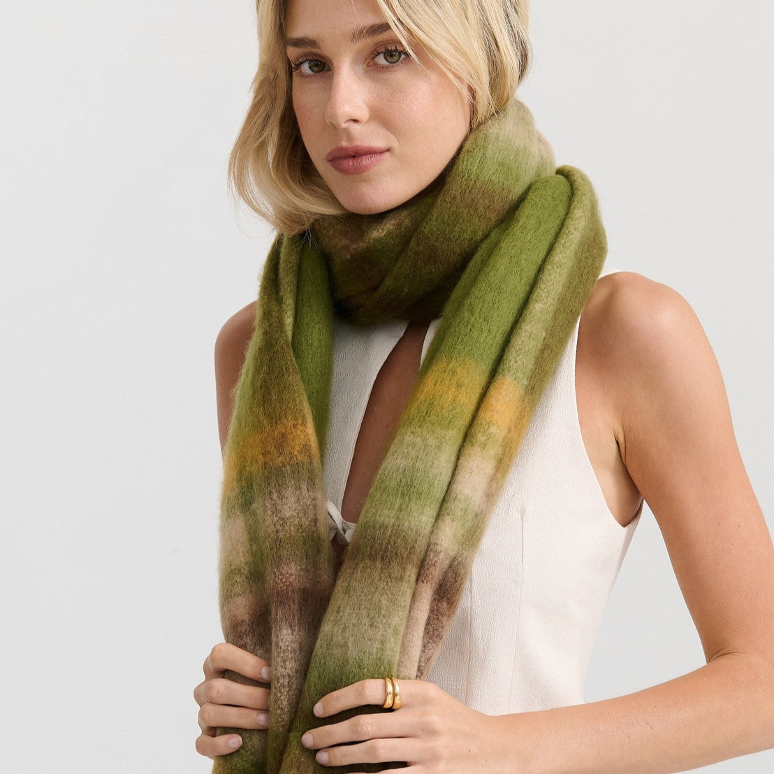 Woman wearing a green scarf 