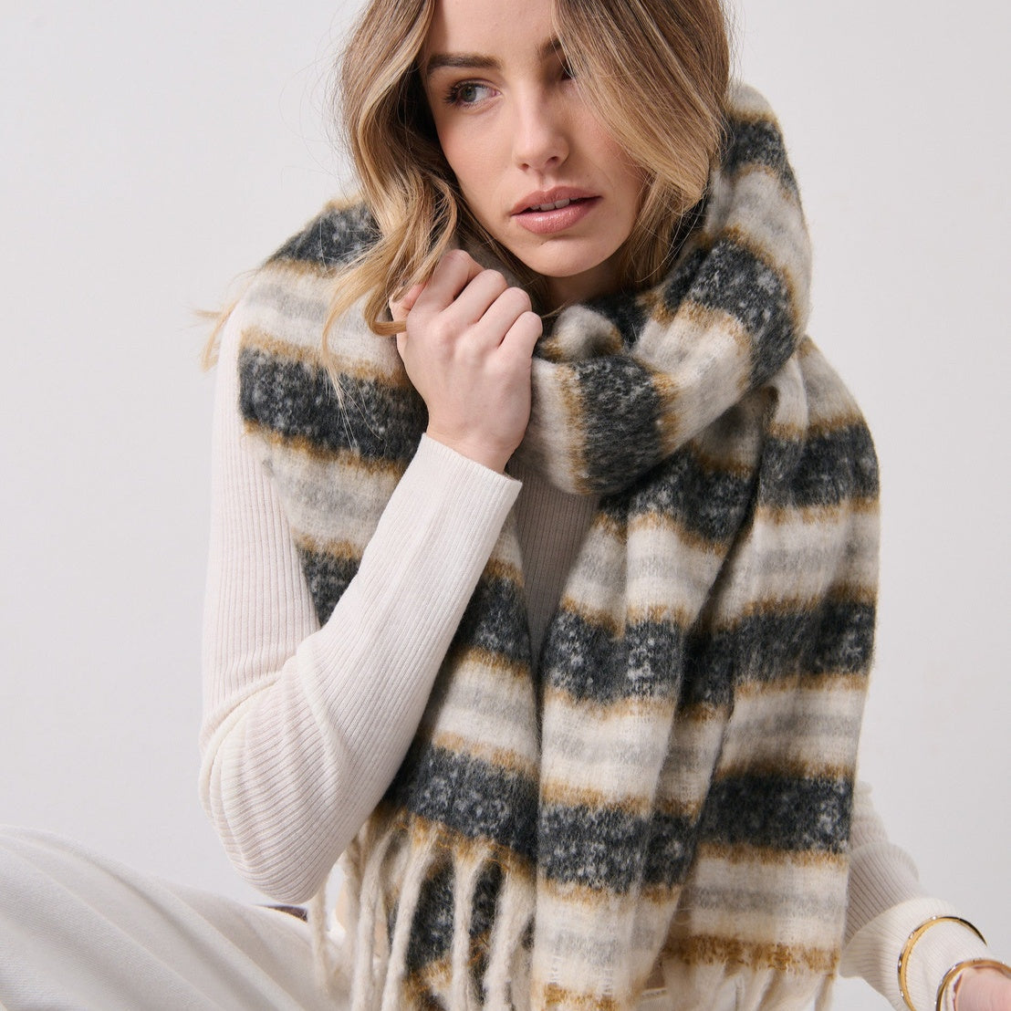Woman wearing a striped scarf 