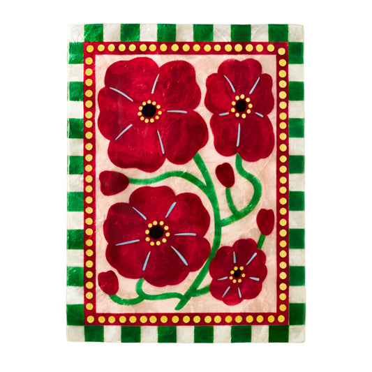 Decorative tile with red floral design