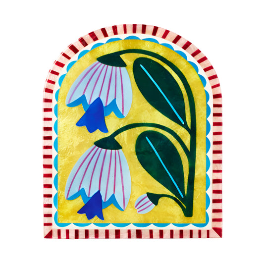 Decorative wall tile with colourful floral design and red striped border